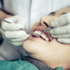 Dentists treat patients' teeth.